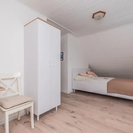 Quarto em Acomodações Particulares Pawel Jakubik